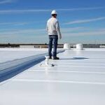 Tpo roof | two rivers roofing, inc foreman overlooking tpo roofing job